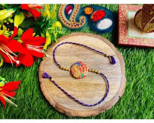 Beautiful Handpainted Clay Rakhi For Your Brother And Bhabhi