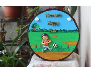 Boy Playing Football Nameplate On Wooden Log