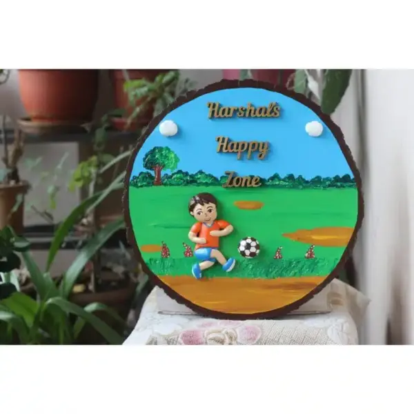 Boy Playing Football Nameplate On Wooden Log 768x768.jpg
