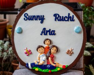 Cute family themed nameplate on wooden log