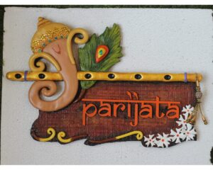 Ganesha With Parijat And Peacock Feather