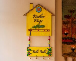 Hut shaped krishna themed nameplate