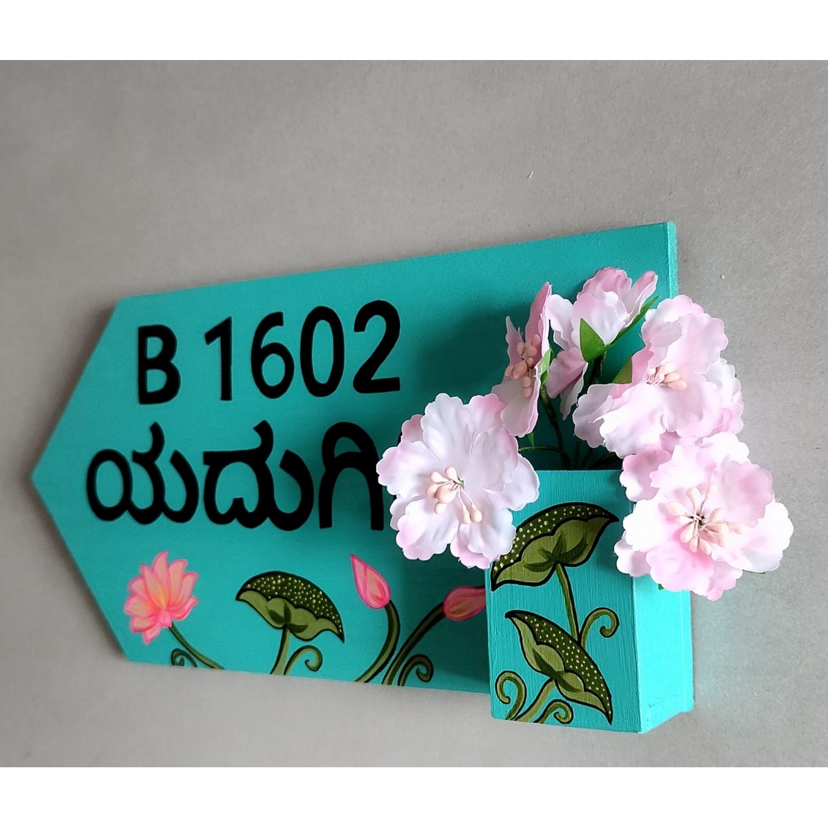 Beautiful floral themed nameplate with artificial flowers